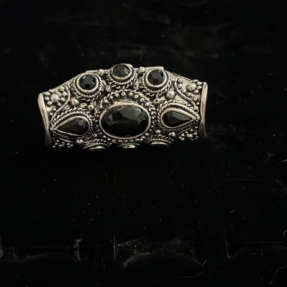 silver and black middle finger ring